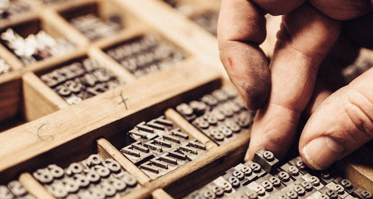 Artisan composing movable type for Letterpress Printing.